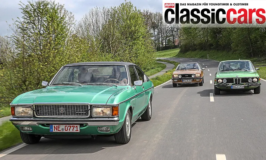 Der Ford Granada 3.0 V6 Coupé/Opel Commodore GS/E Coupé/BMW 2.5 CS fahrend von schräg vorne fotografiert.