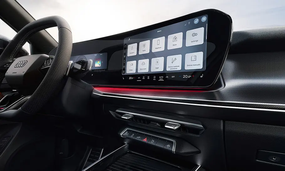 Cockpit des Audi Q3 Sportback (2025) mit zwei 12 Zoll breiten Bildschirmen, fotografiert von rechts.