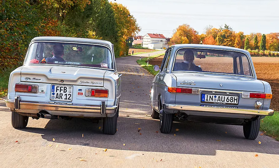 Alfa Romeo Giulia Super 1.3 und Audi Super 90 fahrend von hinten fotografiert.