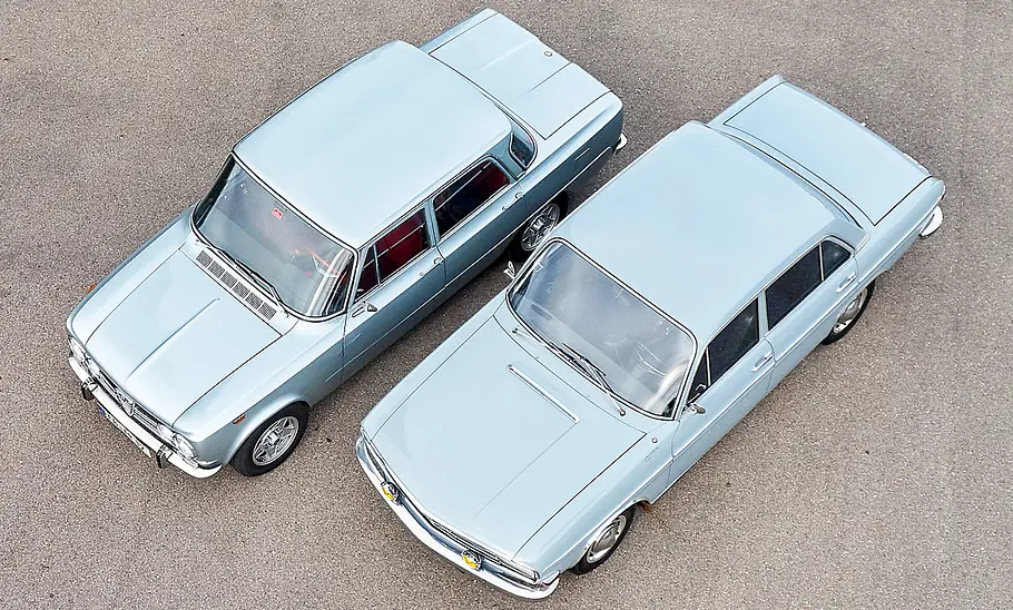 Alfa Romeo Giulia Super 1.3 und Audi Super 90 statisch von schräg oben fotografiert.