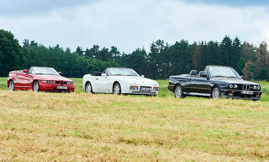 Alfa Romeo R.Z., Porsche 944 S2 Cabrio und BMW M3 Cabrio stehend von schräg vorne.
