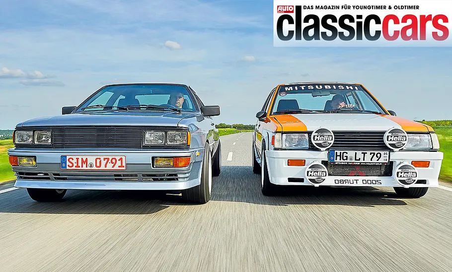 Audi Quattro und Mitsubishi Lancer fahrend von vorne