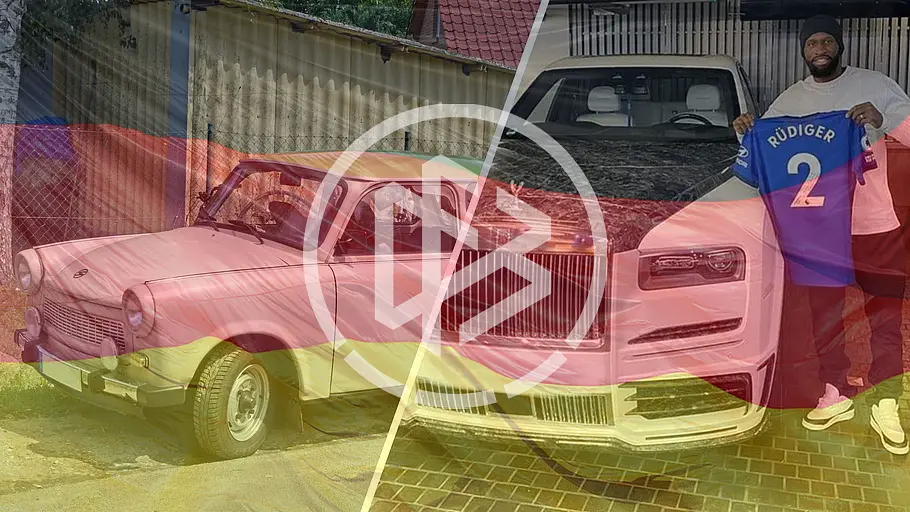 Damit fahren die deutschen WM-Stars Das Symbolbild für die Autos der Fußballer der deutschen Nationalmannschaft zeigt einen Trabi und Antonio Rüdiger an seinem Rolls-Royce Cullinan.