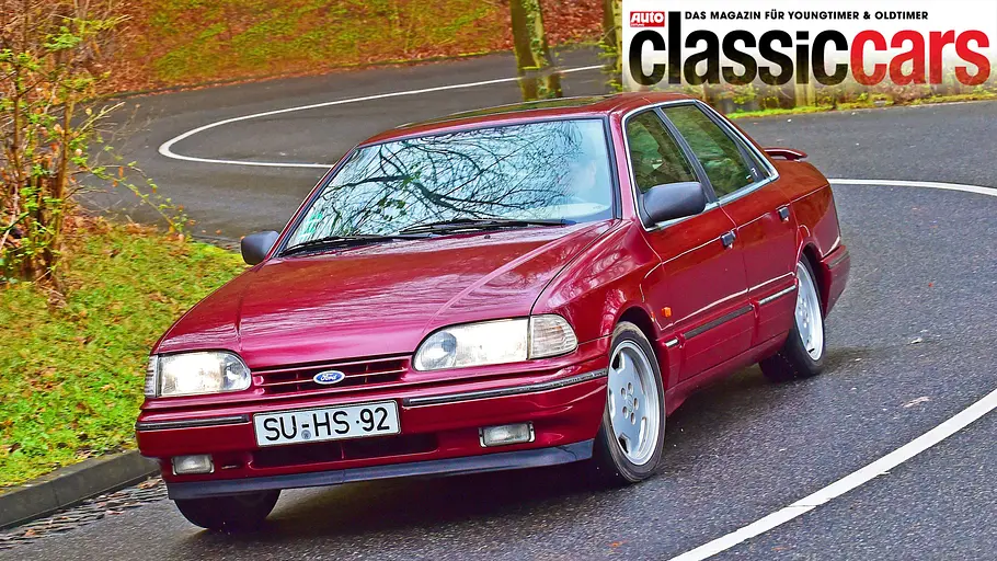 Ford Scorpio Ghia 24V Der Ford Scorpio Ghia 24V fahrend von schräg vorne.