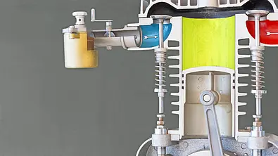 Ein schematischer Querschnitt durch einen Verbrennungsmotor mit sichtbarem Kolben, Hubraum und weiteren Bauteilen. - Foto: Imago