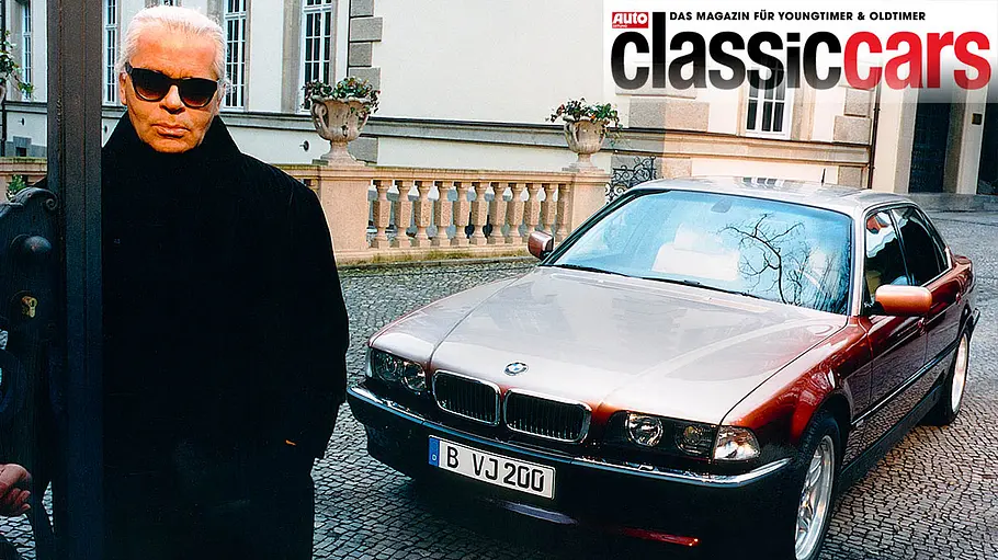 BMW 750iL (E38) Der BMW 750iL (E38) mit Karl Lagerfeld im Vordergrund statisch von schräg vorne fotografiert.