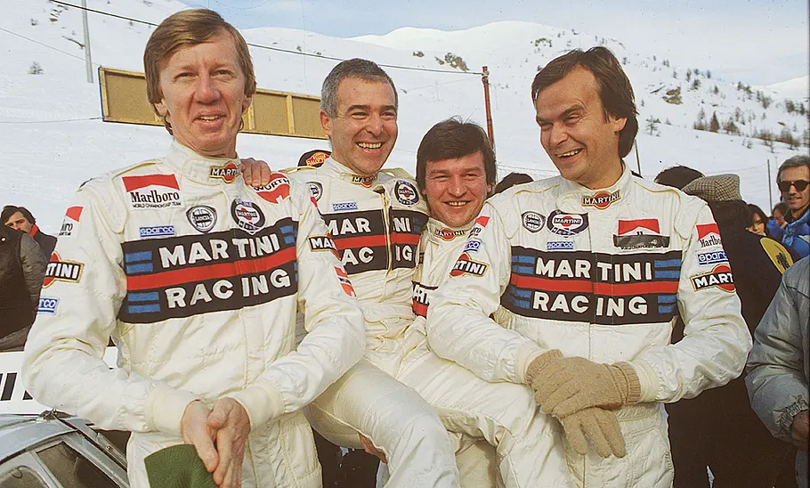 Walter Röhrl mit weiteren Rallye-Piloten des Lancia 037 (1983).